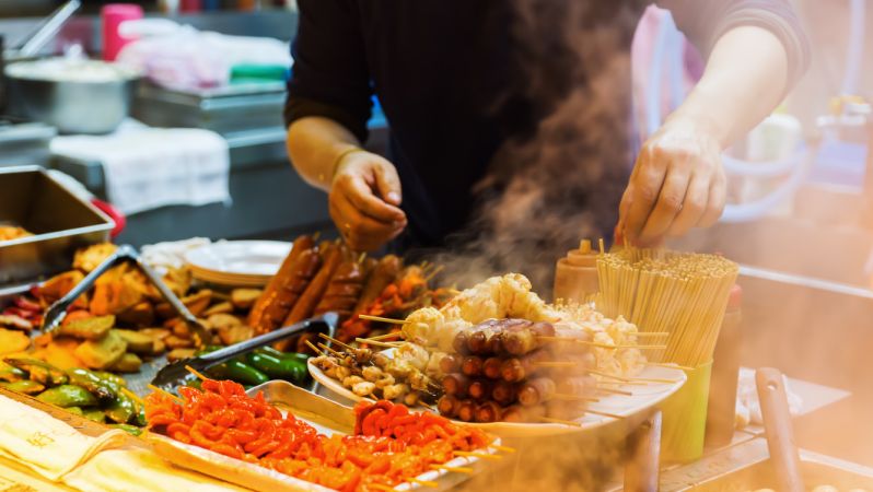 Close-Up Of Person Preparing Food 小食食肆牌照